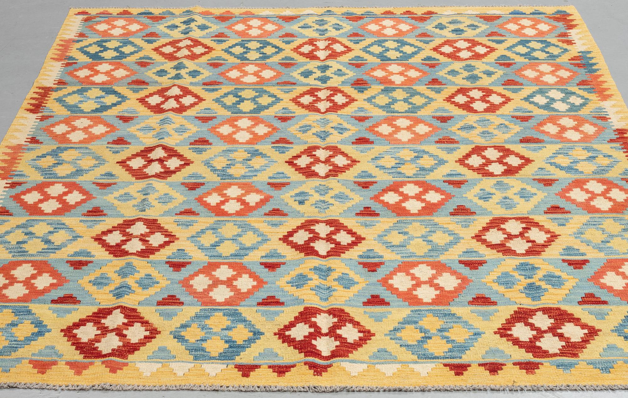 A carpet, kilim, ca 244 x 188 cm.