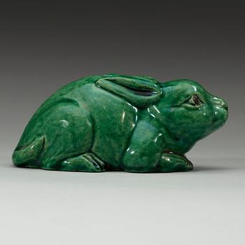 A green glazed figurine, Qing dynasty (1644-1912).