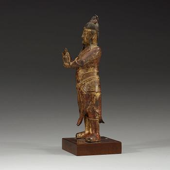 A gilt bronze figure of a High Daoist official, Ming dynasty.
