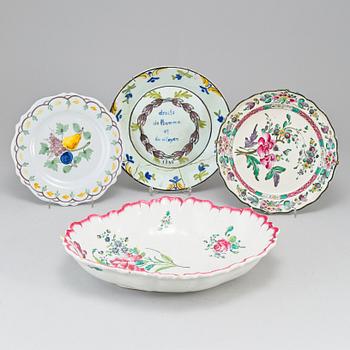 Four faiance dishes and a ceramic bird mounted as a candle stick, some lots French, 19th Century.