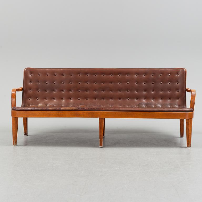 An Axel Larsson stained beech leather upholstered sofa, Svenska Möbelfabrikerna Bodafors, 1930's.