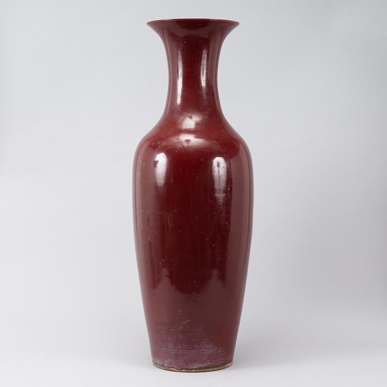 A massive red Chinese porcelain floor vase, modern production.