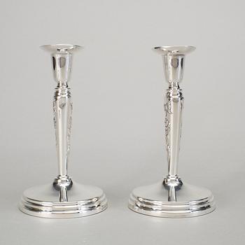 A pair of silver candlesticks by Meya Lerible for Mema, Linköping 1994.