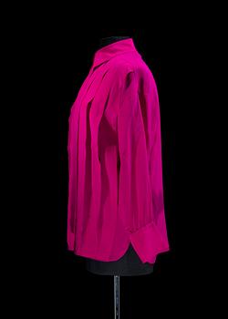 A 1980s cerise silk blouse by Yves Saint Laurent.