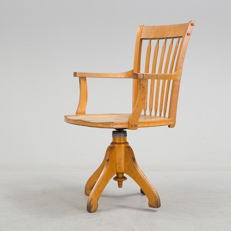 a writing desk chair from the early 20th century.