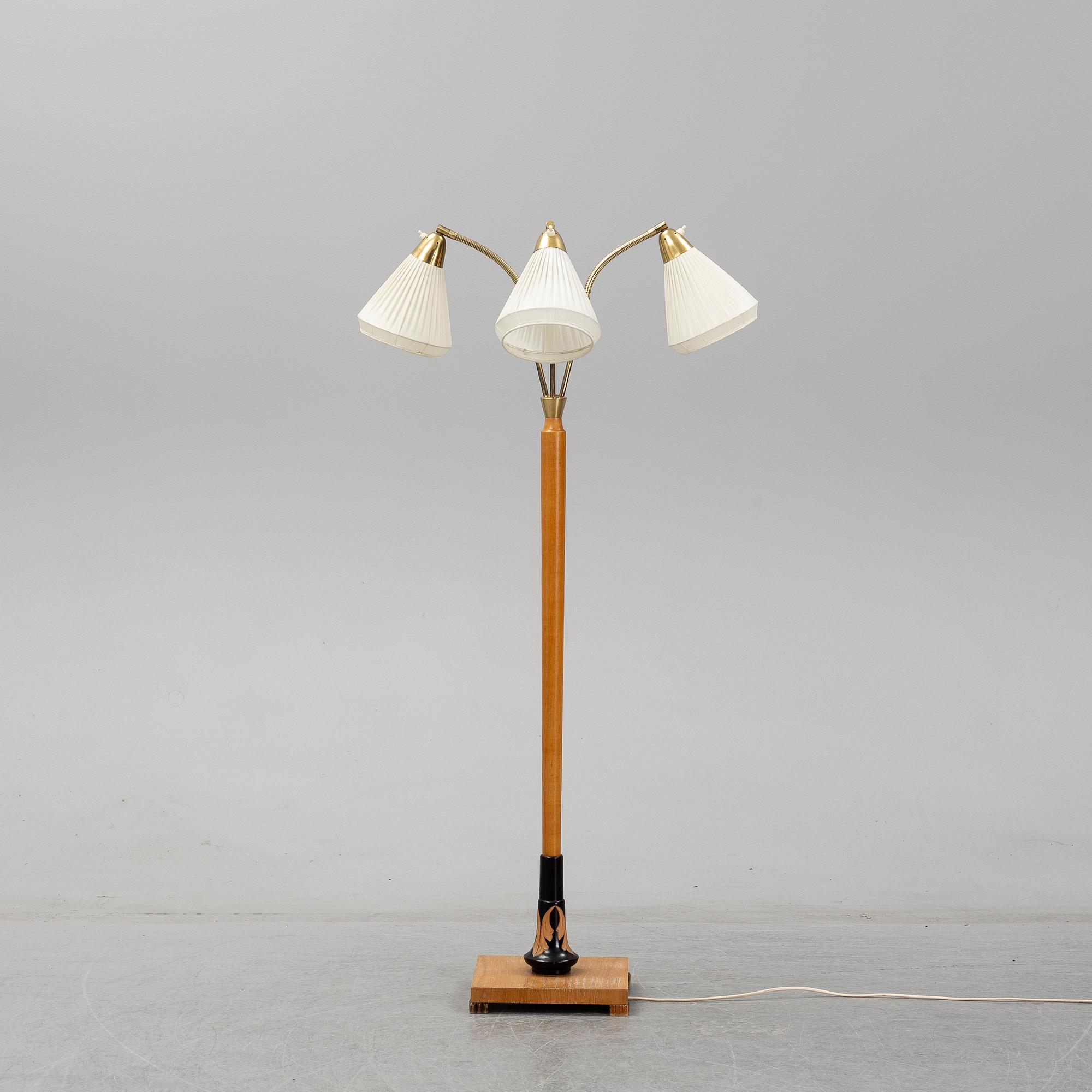 An elm floor light, mid 20th Century.