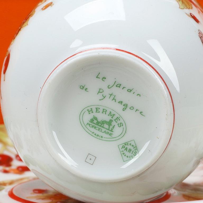 HERMÈS, a pair of porcelain coffecups with plates, "Le Jardin de Pythagore".