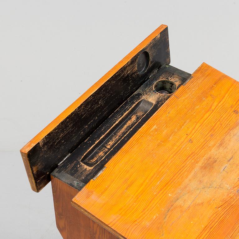A first half of the 20th century school bench.