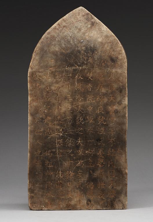 A carved stone stele with, dated according to inscription on reverse to Tang dynasty. Presumably later.