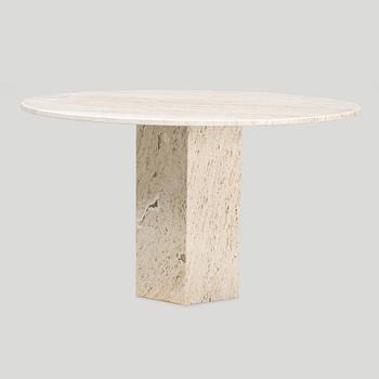 A travertine  'Epic Dining Table' from Gubi.