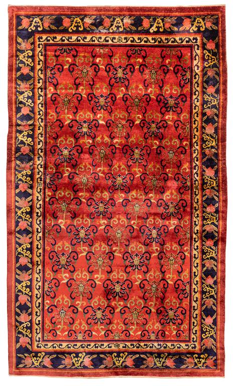 An East Turkestan silk carpet, c. 308 x 182 cm.