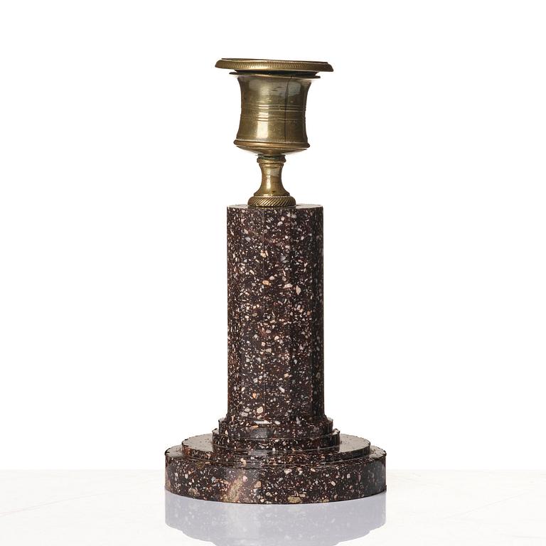 An Empire 'Blyberg' porphyry candlestick from Älvdalen, first part 19th century.