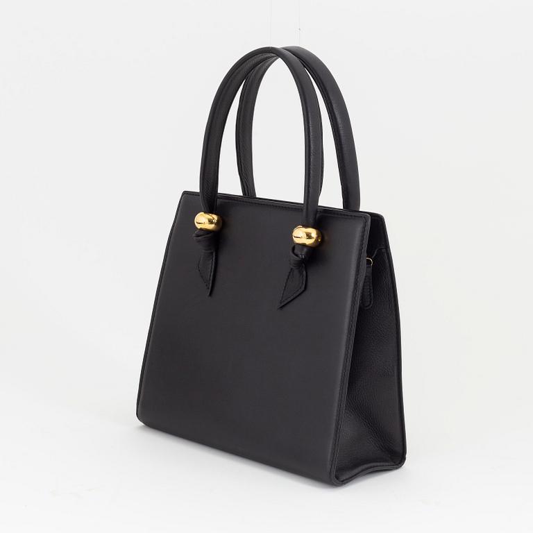 Bally, a black leather handbag.