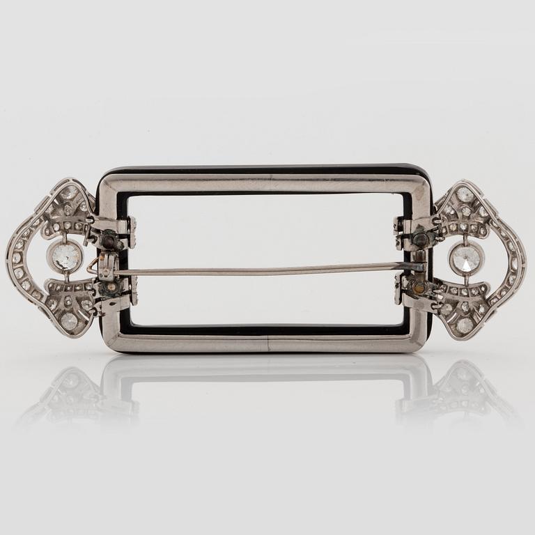 Janesich Art Deco brosch med onyx och gammal- och åttakantslipade diamanter.