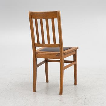 An oak writngdesk with a chair from Åtvidabergs, first part of the 20th century.