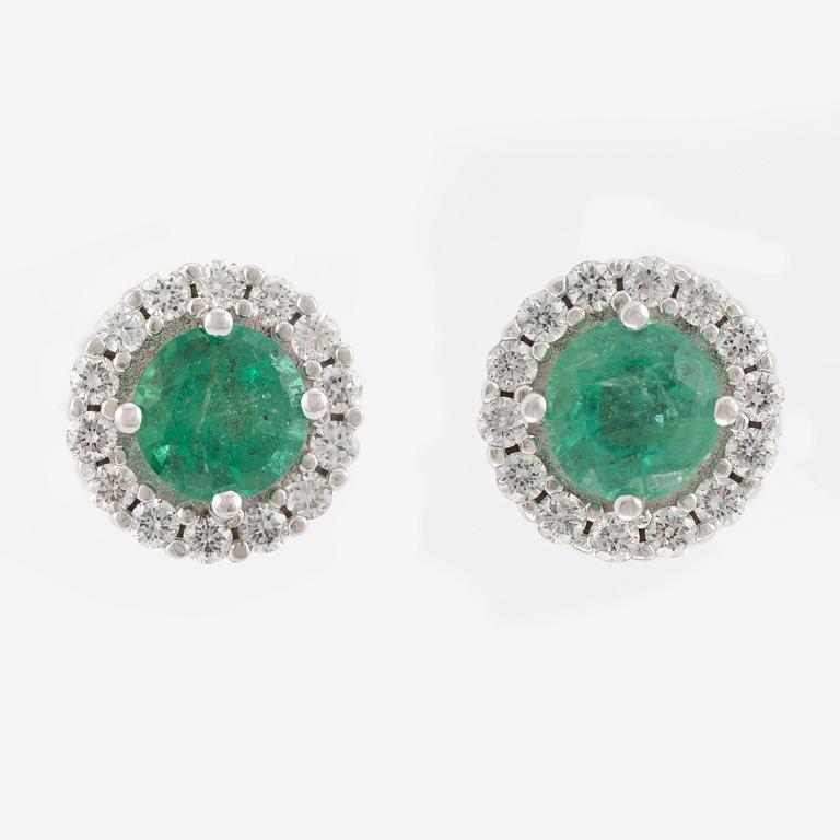 A pair of 18K gold earrings with faceted emeralds and round brilliant-cut diamonds.