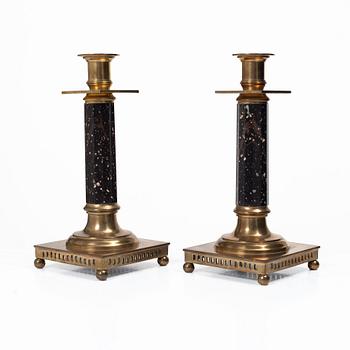 A pair of candlesticks brass and porphyry, EOS Jönköping, 20th century.