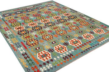 A Kilim carpet, c. 392 x 312 cm.