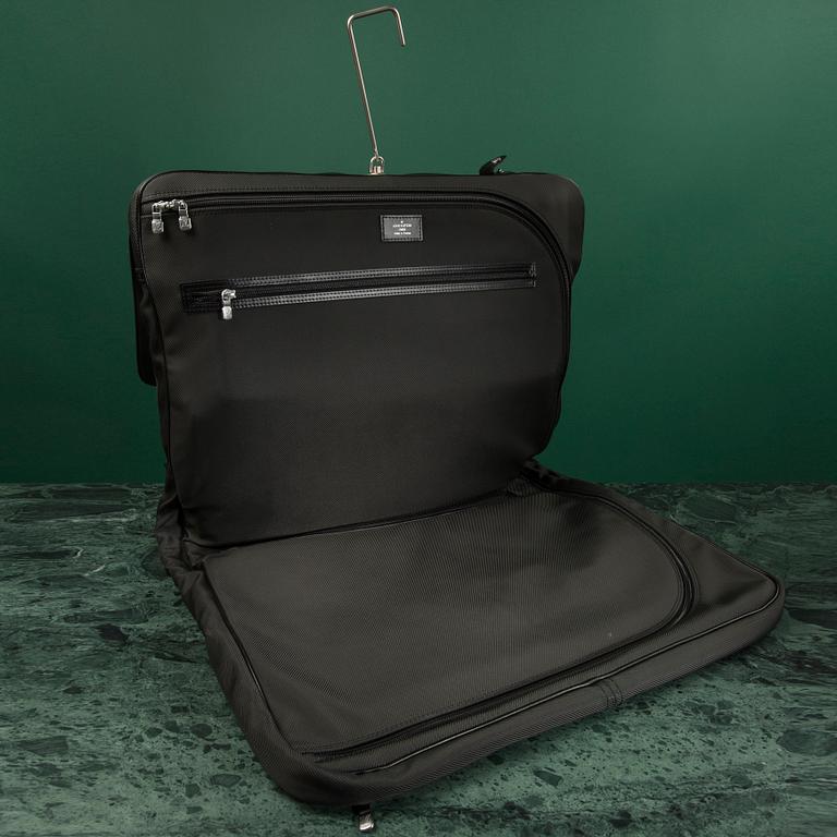 A Garment bag by Louis Vuitton.