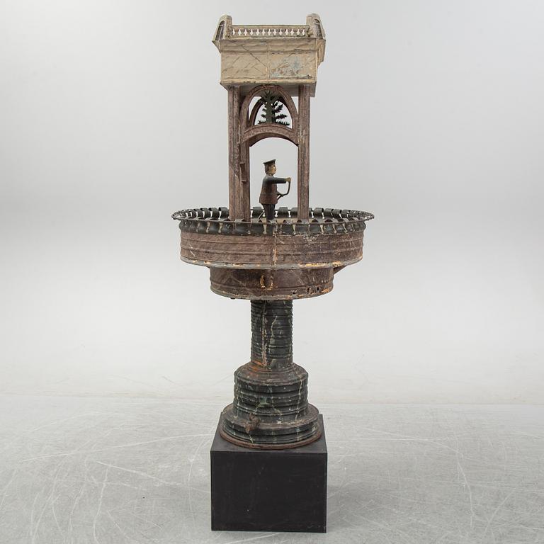 A painted and richly decorated plate garden fountain, late 19th century.