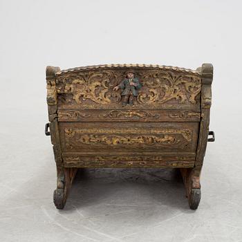 A childrens sleigh middle european dated 1709.