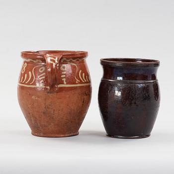 two earthenware pots from the 19th century.