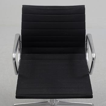 A 'EA 104 Swivel' armchair by Charles & Ray Eames, Vitra, 2016.