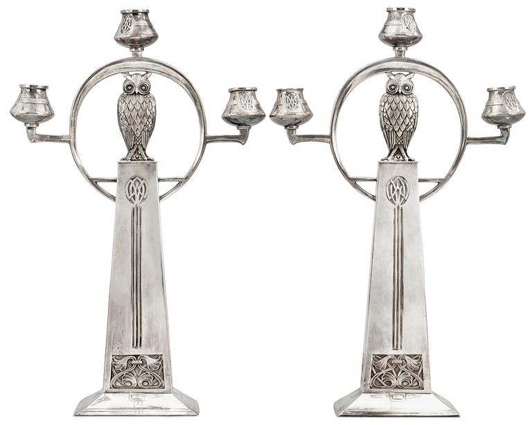 A pair of WMF Art Nouveau silver plated metal candelabra.
