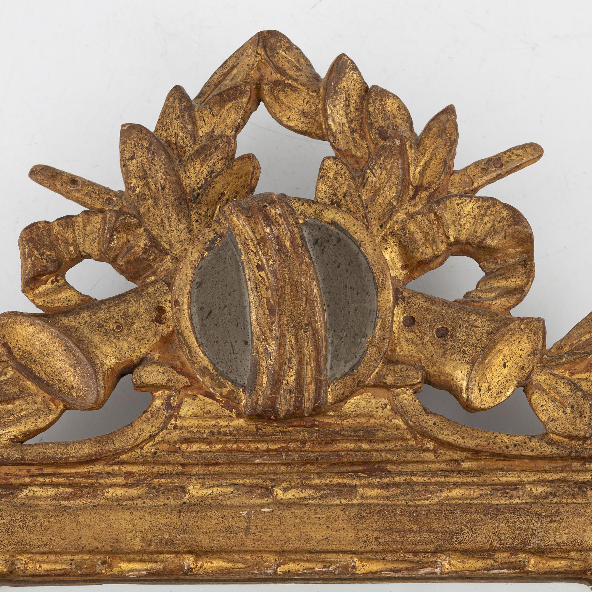 A Gustavian style mirror, around the year 1900.