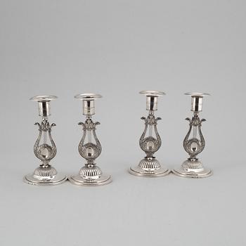 A Swedish 19th century matched set of four silver candlesticks, mark of Johan Petter Grönvall, Stockholm 1824.