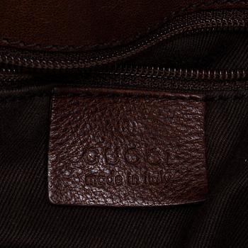 GUCCI, A canvas and leather bag.