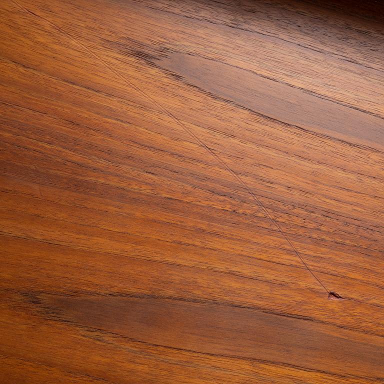 A teak-veneered mid 20th century sideboard.