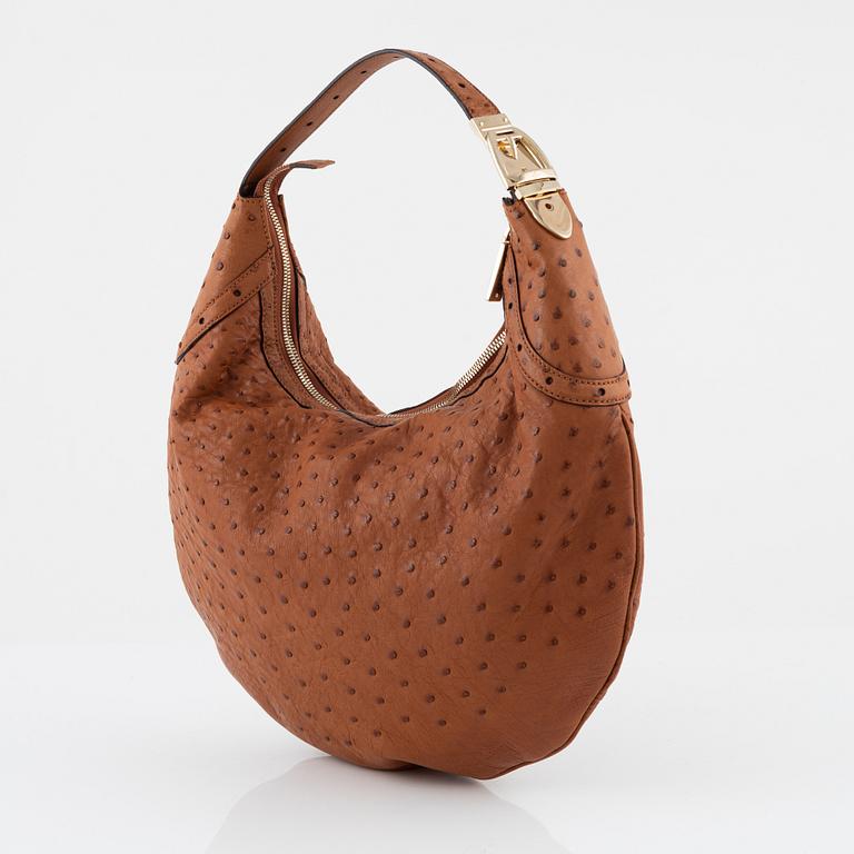 Gucci, an ostrich handbag.