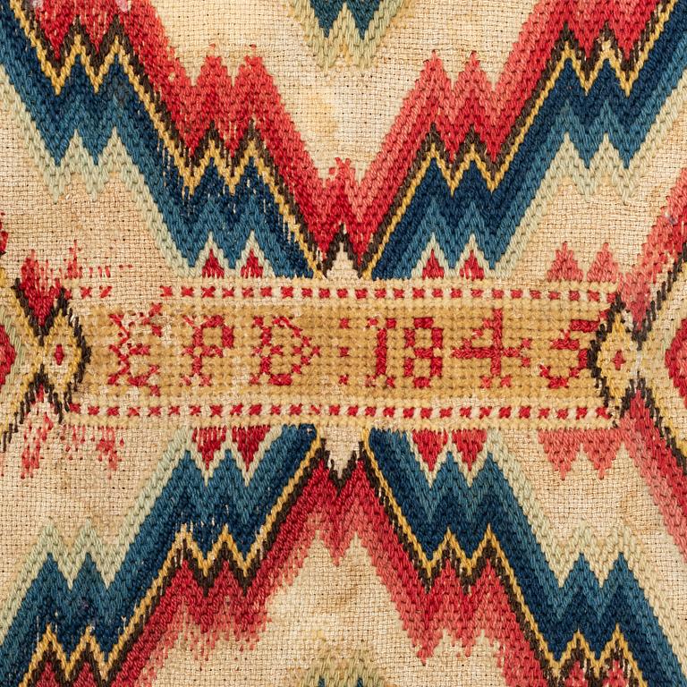 Åkdyna,  Skåne korsstygn och tvistsöm daterad 1845 EPD, ca 142 x 38 cm.