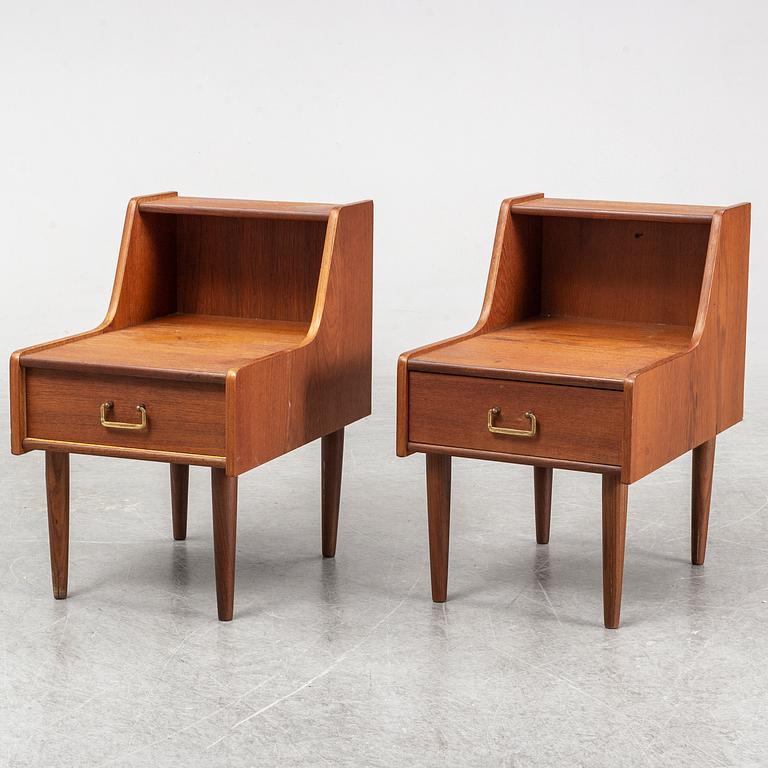 A pair of teak veneered bedside tables.
