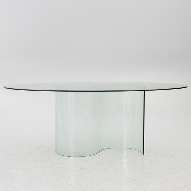 A dining table, glass, contemporary.