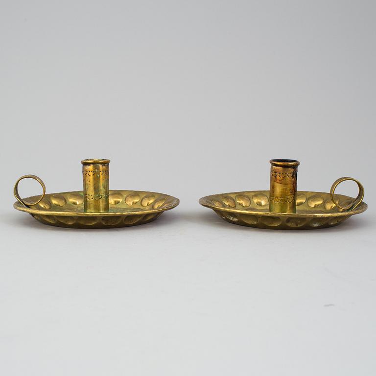 A pair of brass baroque style candlesticks.