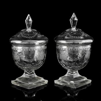 A pair of cut glass jars with covers, late 19th Century.