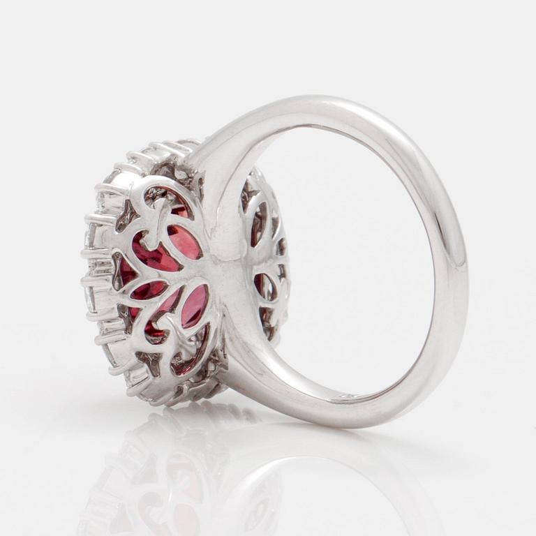 A 5.12 ct unheated red-orange sapphire and brilliant cut diamond ring. Total carat weight of diamonds circa 1.48 cts.