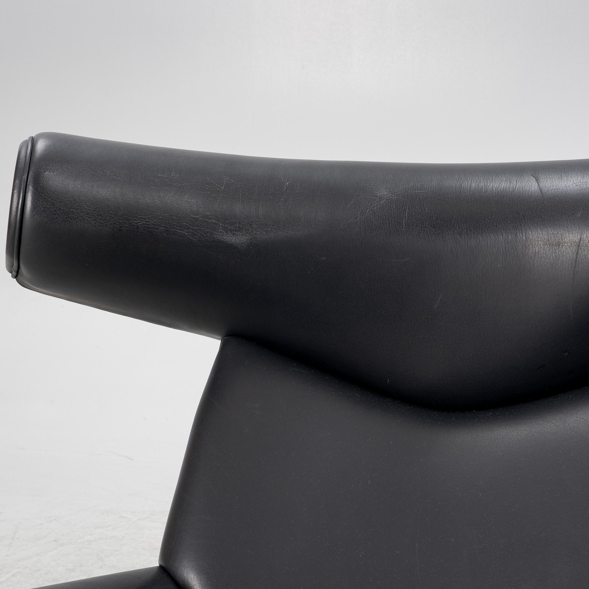 Hans J. Wegner, fåtölj med fotpall, "Ox Chair", EJ-100, Erik Jørgensen Møbelfabrik A/S, Svendborg, Danmark.