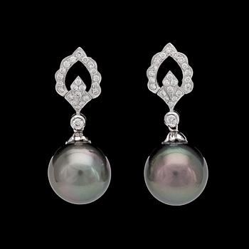 969. A pair of cultured Tahitit pearl, 14,4 mm, and diamond earrings, tot. app. 0.50 cts.