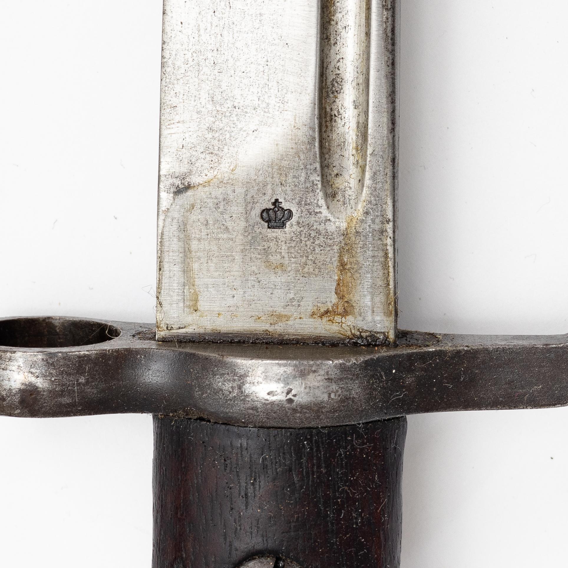 Three Swedish bayonets with scabbards.