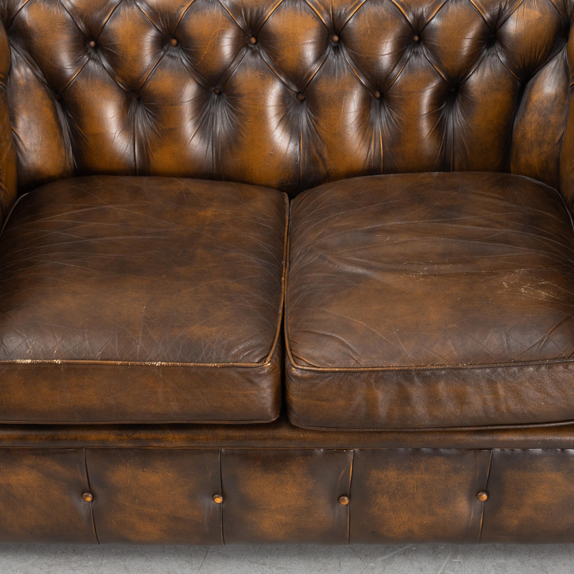 A leather upholstered  Chesterfield sofa, England, second part of the 20th Century.