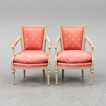 A pair of gustavian style armchairs, second half of the 20th century.