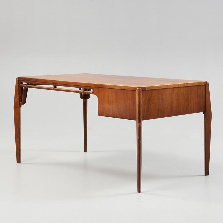 A Carl-Axel Acking Swedish Modern mahogany desk, Nordiska Kompaniet, 1950's.