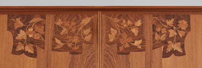 Carl Malmsten, A Carl Malmsten walnut and mahogany cabinet with floral inlays, Sweden 1959.