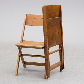 a set of 8 foldable chairs from the 1930's.