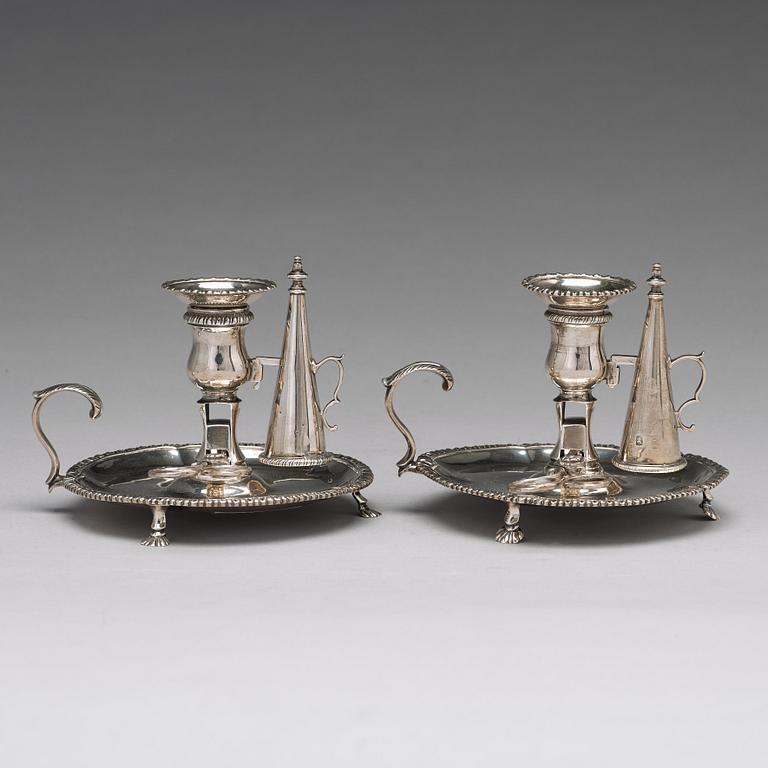 An English pair of 18th century silver chamber candlesticks, mark probobly of Ebenezer Coker, London 1770.