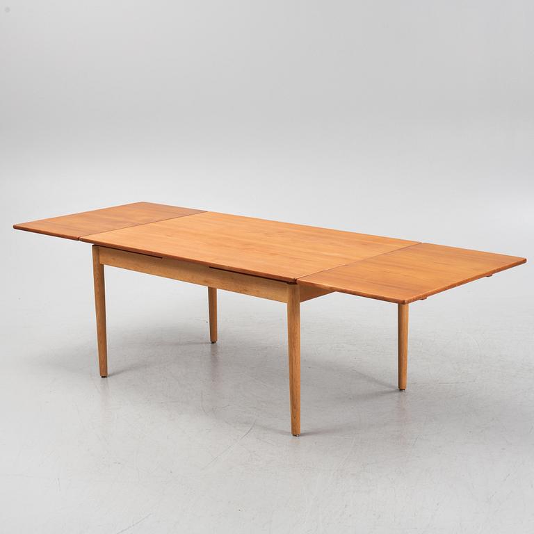 Hans J. Wegner, an oak and teak dinner table for Andreas Tuck. Denmark.