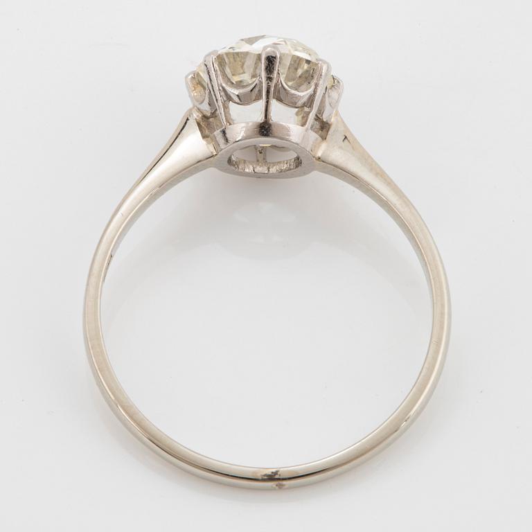 An 18K white gold ring set with a cushion formed old-cut diamond weight ca 2.75 cts quality ca L/M i.